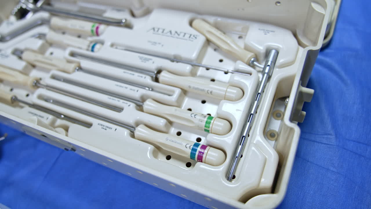 Box with a set of modern medical tools used at neurosurgery. Diversity of instruments close up.