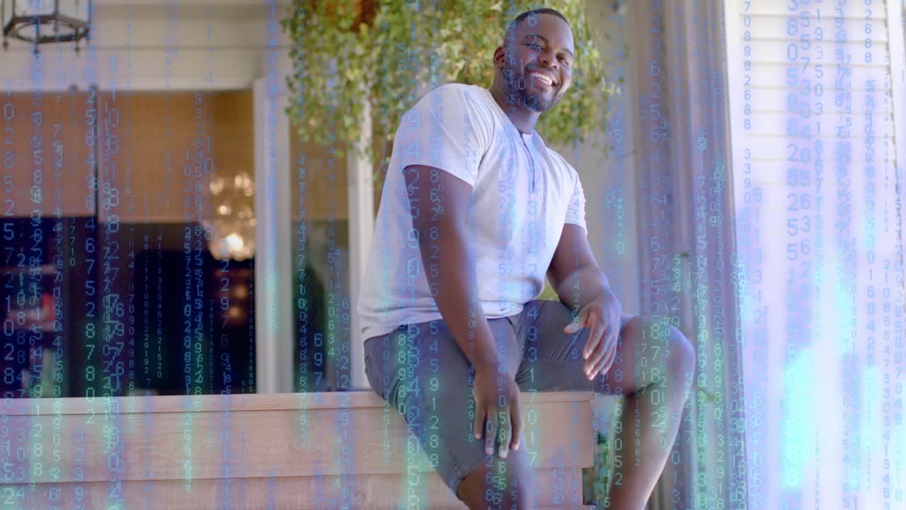 Man sitting on low ledge, shifting, laughing, showing tech code overlay rising, masking then fading