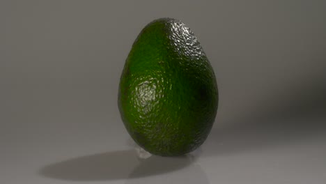 ripe green avacado on a white background