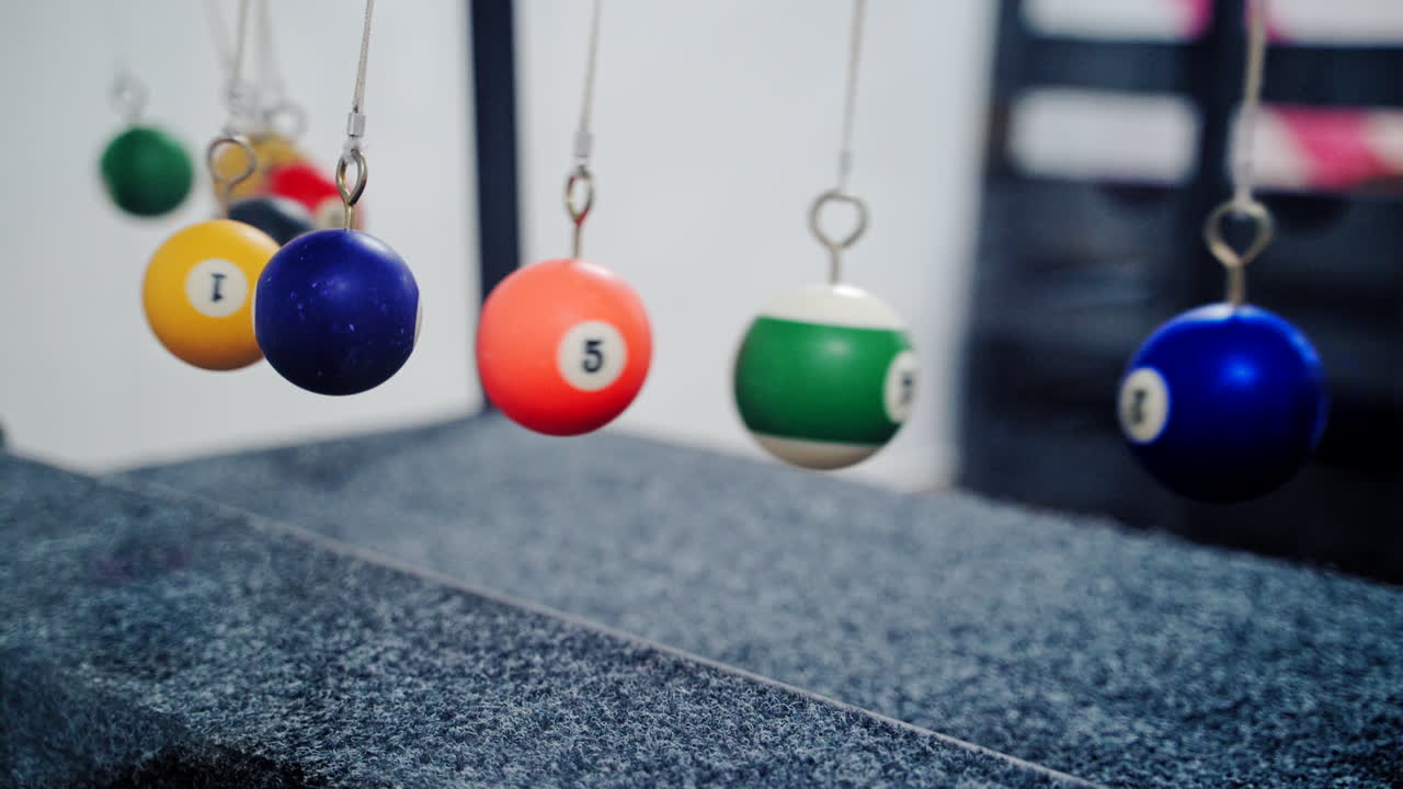 Newton's cradle showing laws of physics in motion. Museum of Science