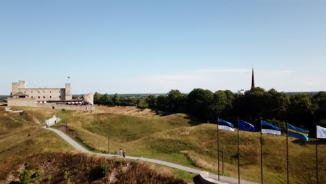 drone footage of people walking at rakvere new amusement center up to sky