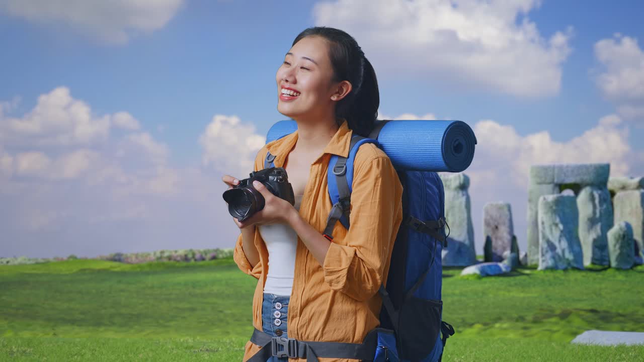 Woman Traveler with Camera at Stonehenge