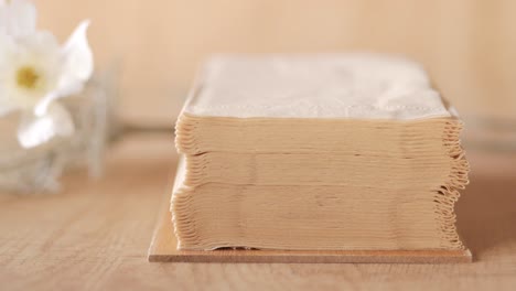 stack of tissues on wooden tray