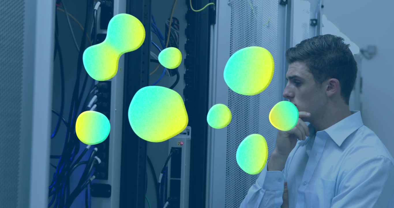 Animation of stains over caucasian male worker inspecting server room