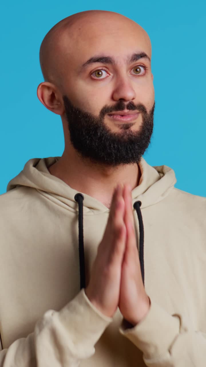 Vertical Video Middle eastern man praying to Allah for forgiveness