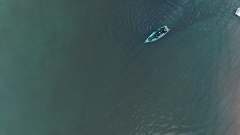 Aerial-Top-Down-close-up-Drone-View-of-rural-beach-town-Caraiva-Bahia-Brazil-flying-over-the-river-with-boats