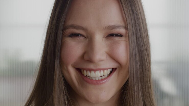 Portrait beautiful business woman smiling happy laughing in office