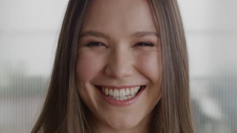 Portrait-beautiful-business-woman-smiling-happy-laughing-in-office