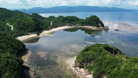 twin rock resort in virac, catanduanes with lush greenery and clear waters, aerial view