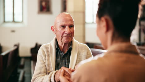 elderly man praying in church with support