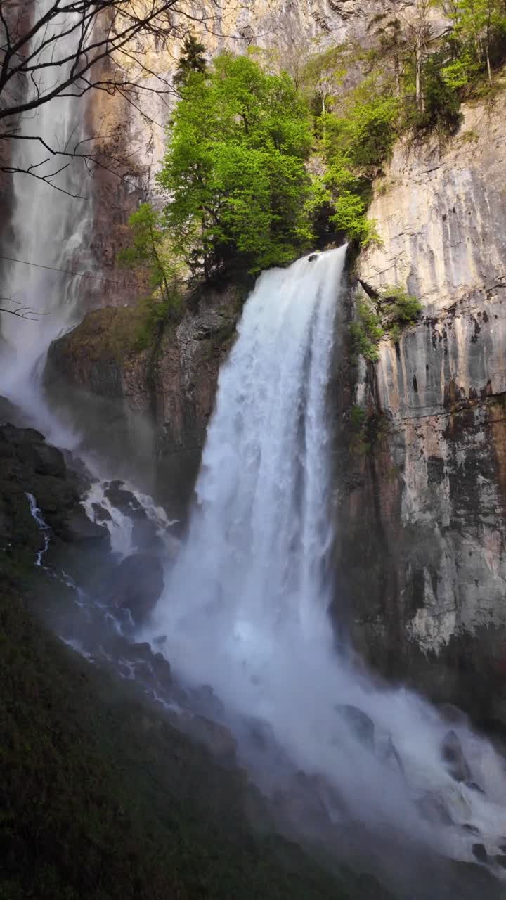 Waterfall water cascade Seerenbach Falls in Switzerland, nature Swiss Alpine highlands