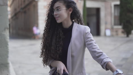 young woman on a bicycle in a european city