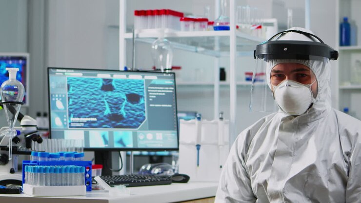 Portrait of tired chemist man doctor in coverall
