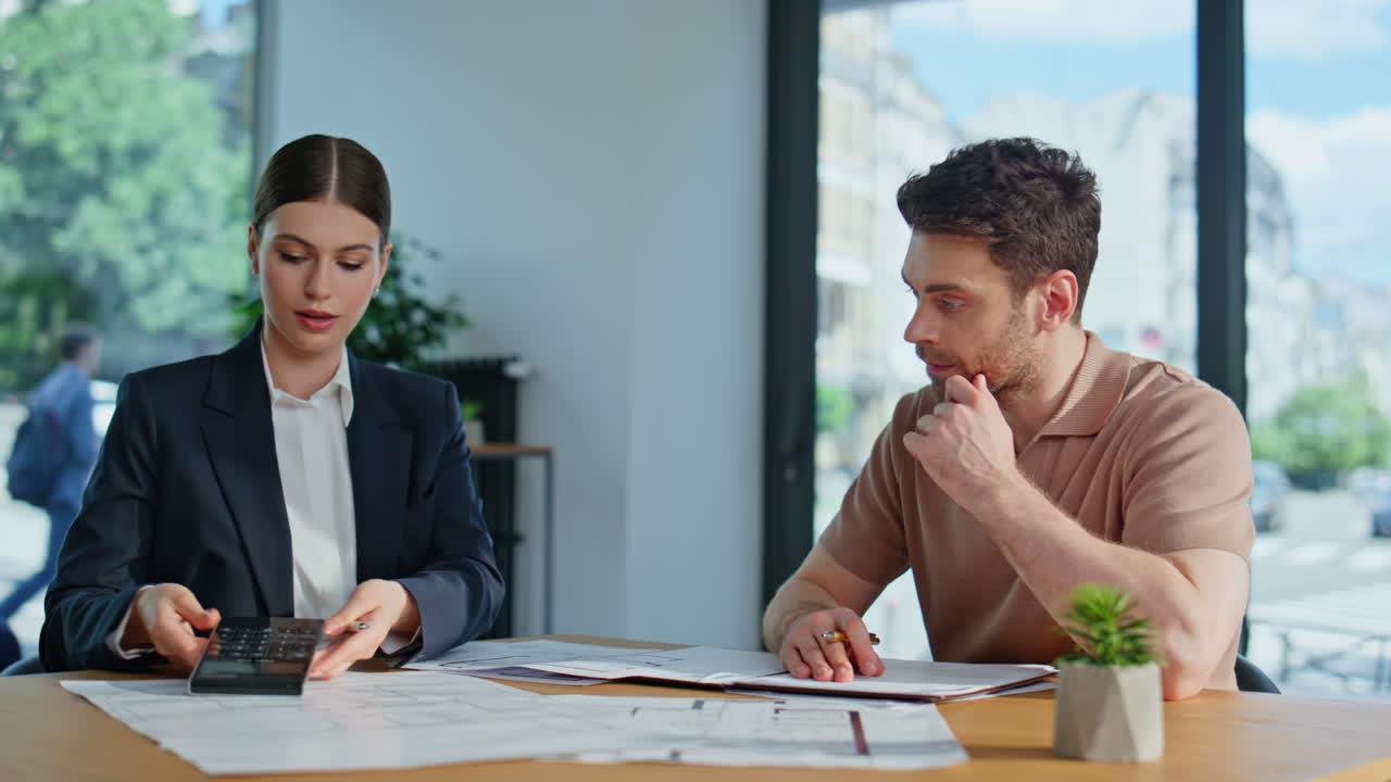 Woman accountant explaining report to man in office financial company closeup