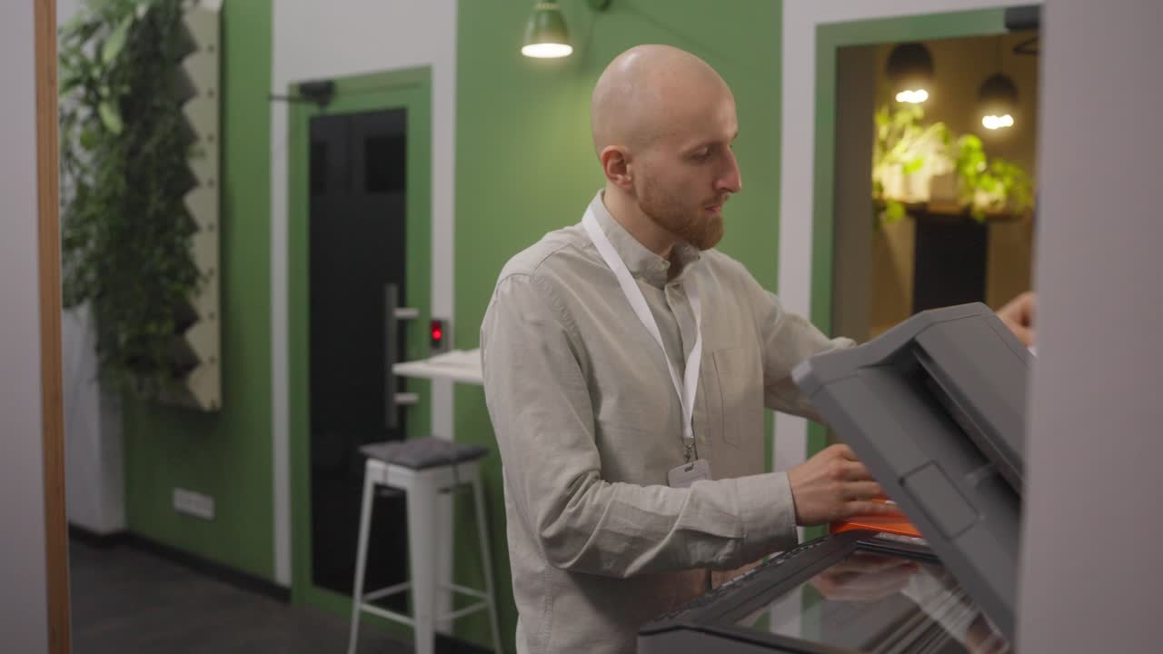 Man using a printer in an office