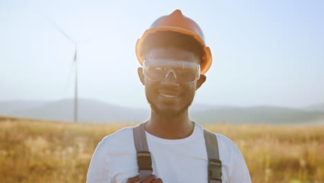 smiling worker at wind farm