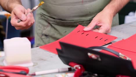 Italian-shoemaker,-making-leather-bag-with-traditional-machines