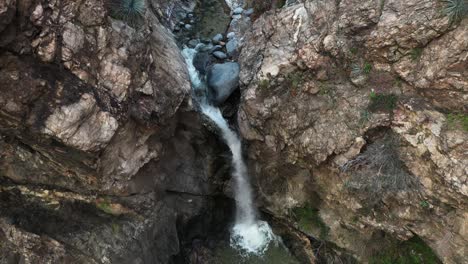 hikers gathered around eaton canyon falls after a long hike in angeles national forest, california