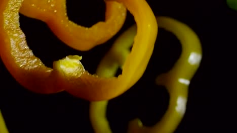 falling raw bell pepper pieces