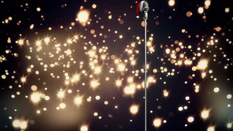 Animation-of-glowing-gold-lights-over-microphone-with-christmas-hat-on-dark-background