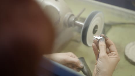 polishing a metal charm