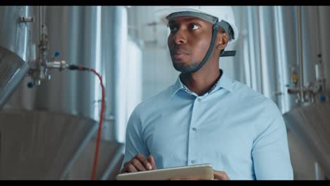 engineer inspecting brewery equipment