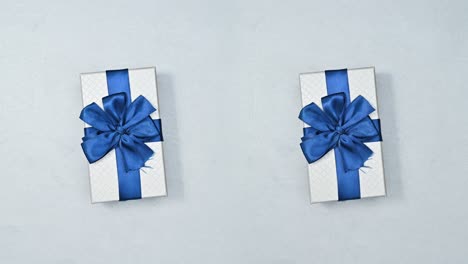 two gifts rotating and changing on silver theme. stop motion