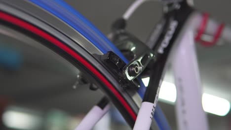 close-up of a road bike's caliper brake and wheel