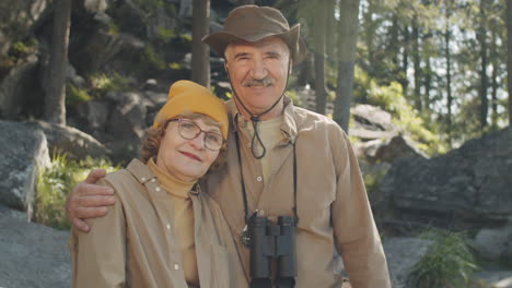 senior couple hiking in the mountains