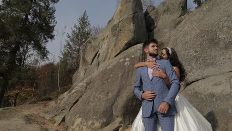 Groom-with-bride-near-mountain-hills.-Wedding-couple.-Happy-family-in-love