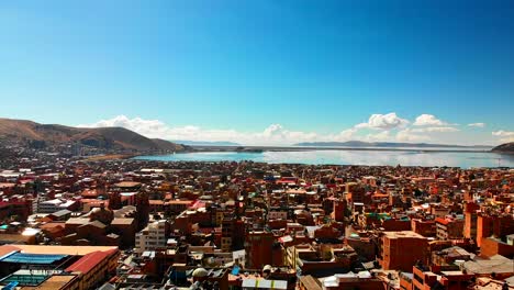 Lake-Titicaca-town-Puno,-Highest-lake-in-the-world,-Lago-Titicaca,-large-freshwater-lake-in-the-Andes-mountains-on-the-border-of-Bolivia-and-Peru,the-highest-navigable-lake-in-the-world,-Monomictic