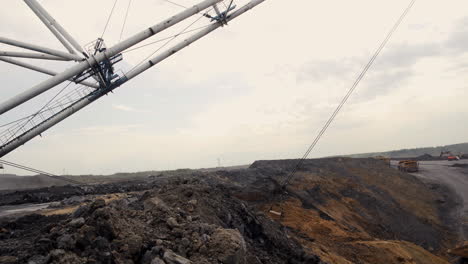 coal mining operation with crane and trucks