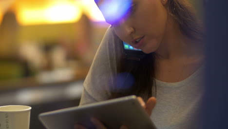 woman planning the evening using gadgets