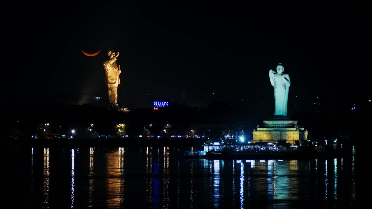 Waxing Crescent Moon timelapse with B. R. Ambedkar statue and buddha statue at Tank bund, Hyderabad, Telangana. 4k