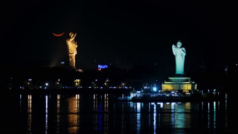 waxing crescent moon timelapse with b. r. ambedkar statue and buddha statue at tank bund, hyderabad, telangana. 4k