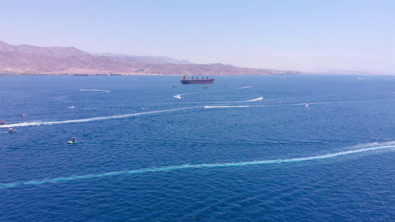 Large Gas Tanker Ship in The red sea With small boats Aerial