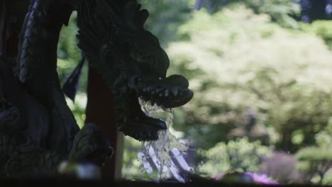 Beautiful-Scenery-of-Dragon-Water-Fountain-in-Japan-With-Glorious-Trees-In-the-Background---Slow-Motion-Shot