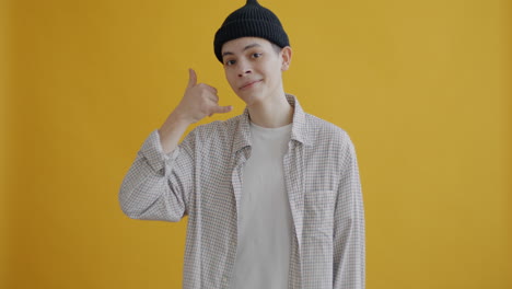 young man gesturing call
