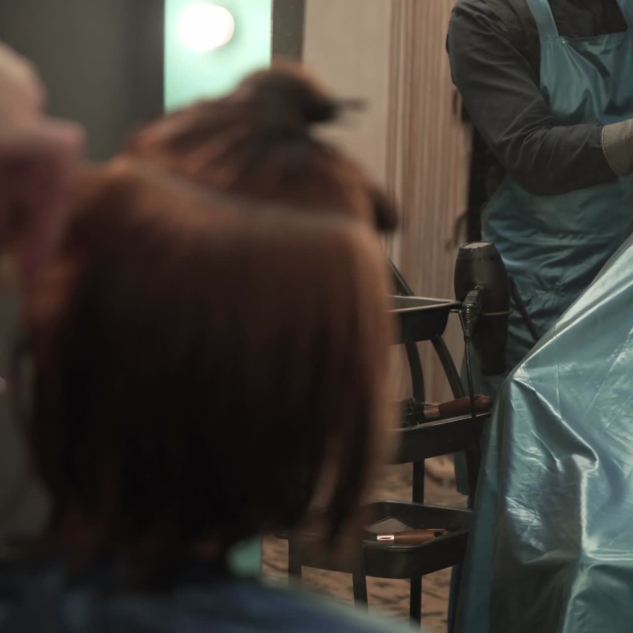 Professional hairdresser cutting hair