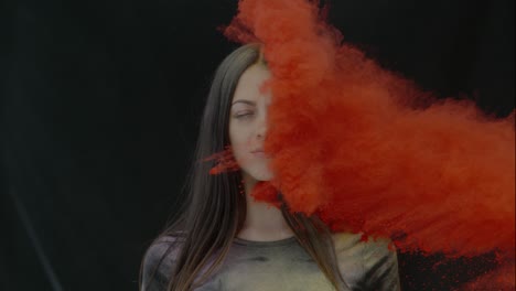 girl in color powder explosion slow motion