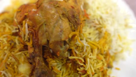 Close-up-Top-view-of-Bombay-biryani,-Traditional-spicy-indian-food,-Iftar-meal,-Chicken-rice,-Ramadan-dinner