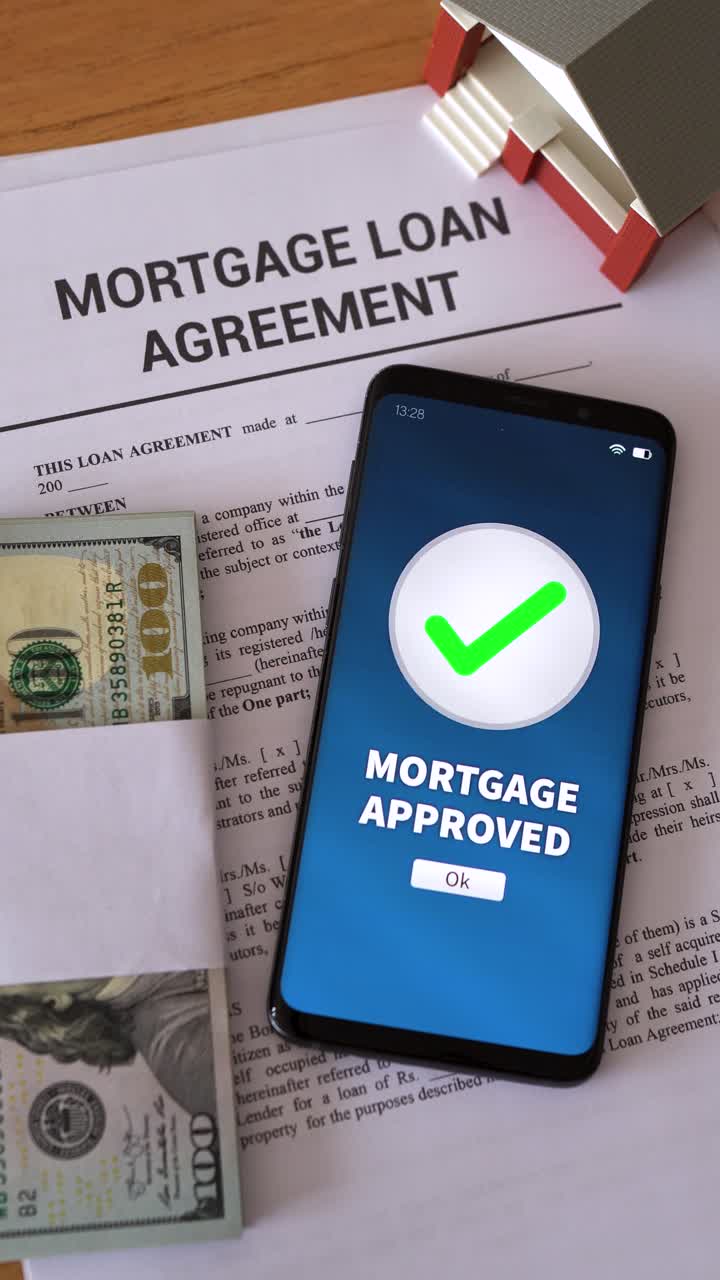 Mortgage loan approved notification. Concept of getting in debt to buy real estate. Vertical shot.