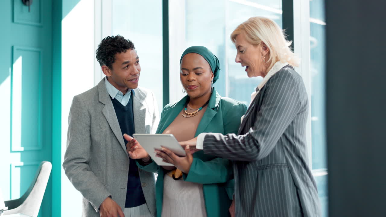 Business Team Discussing Project on Tablet