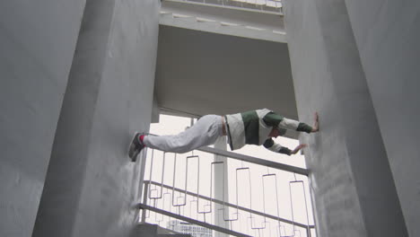 parkour athlete climbing between two walls
