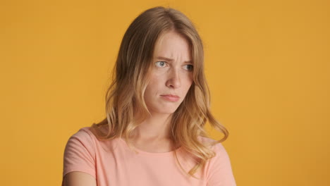 upset caucasian woman with tongue out on camera.