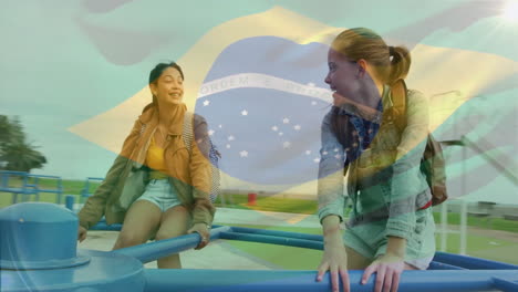 animación de la bandera de brasil sobre una pareja de mujeres biraciales jugando