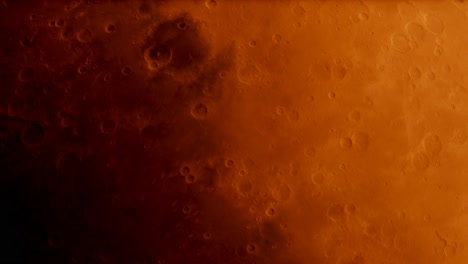 mirando hacia abajo al planeta marte desde el espacio mientras gira, los cráteres y las dunas de arena roja se mueven lentamente hacia la sombra.