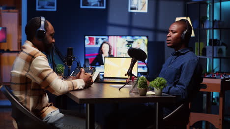 podcast guest in studio sharing facts, surrounded by sound engineering equipment