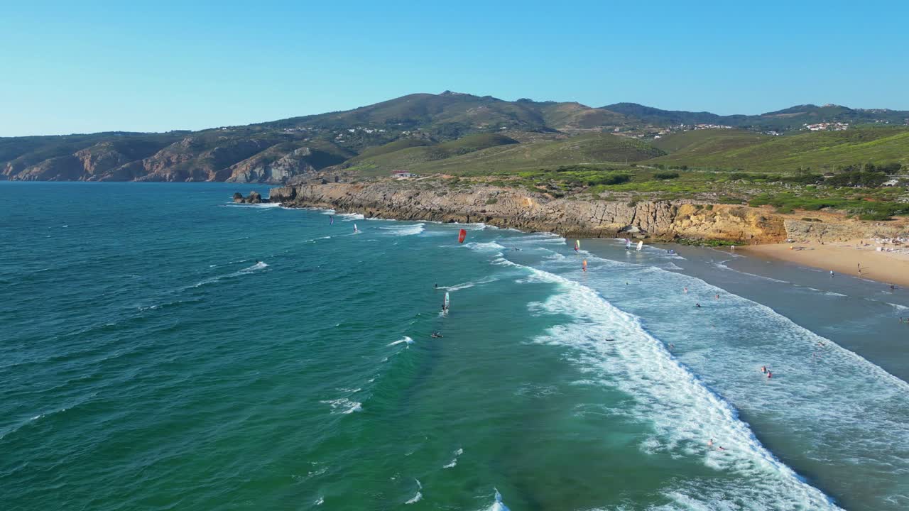 Aerial view from Guincho beach in a day with wind where kitesurfers and windsurfers take advantage of the appropriate time to practice their sports,Cascais,Portugal