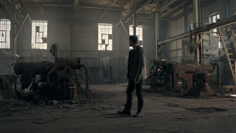 man in abandoned industrial building